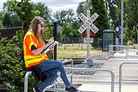 researcher by rail crossing